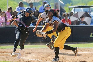 UAPB first baseman Samaria Jackson tags Texas Southern hitter Marissa Perla after a bunt during Monday's softball doubleheader at the Torii Hunter Softball Complex in Pine Bluff. (Special to the Commercial/William Harvey)